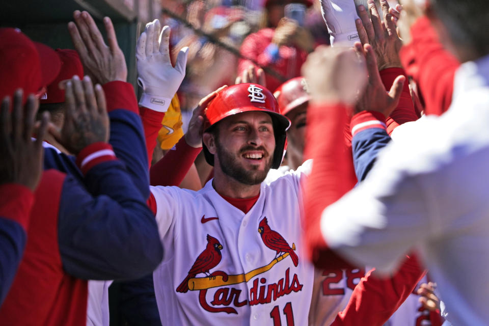 St. Louis Cardinals' Paul DeJong is congratulated by teammates after hitting a two-run home run during the third inning of a baseball game against the Pittsburgh Pirates Saturday, April 9, 2022, in St. Louis. (AP Photo/Jeff Roberson)