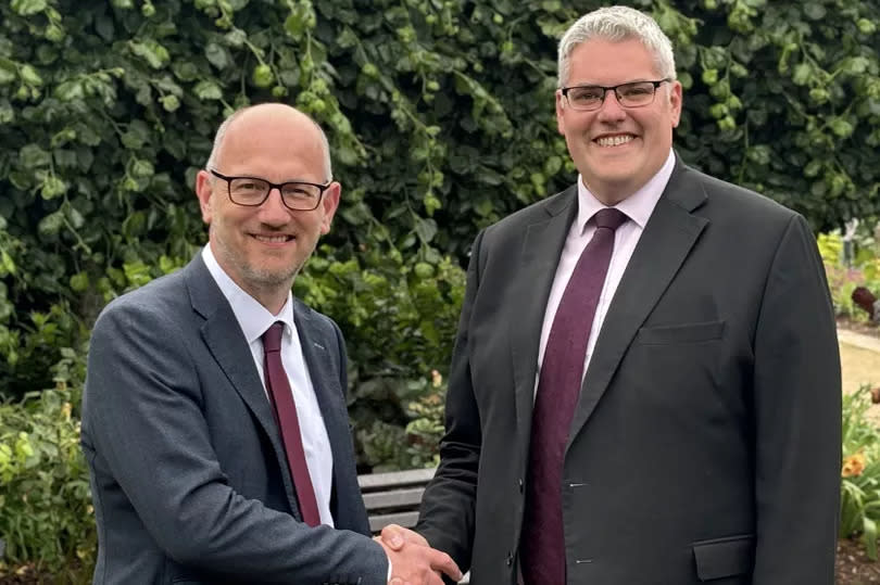 Peter Martin pictured with party leader Gavin Robinson