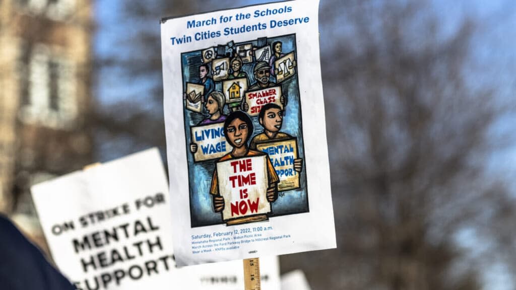 Minneapolis school teachers hold placards during the strike in front of the Justice Page Middle school in Minneapolis, Minnesota, United States on March 8, 2022. (Photo by Kerem Yucel/Anadolu Agency via Getty Images)