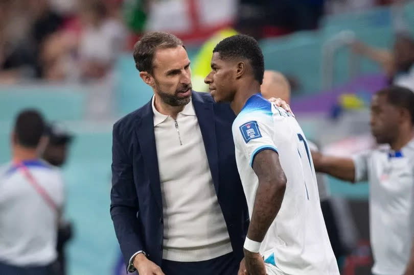 Marcus Rashford speaking to Gareth Southgate