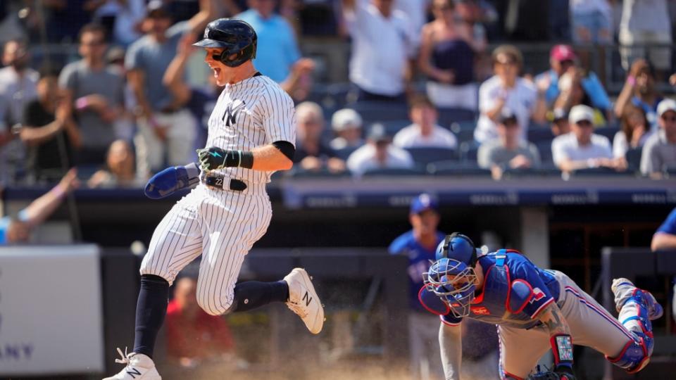 June 25, 2023;  Bronx, New York, USA;  New York Yankees center fielder Harrison Bader (22) scores a run on an RBI single hit from designated hitter Giancarlo Stanton (not pictured) against the Texas Rangers in the eighth inning at Yankee Stadium.  Mandatory Credit: Gregory Fisher-USA TODAY Sports