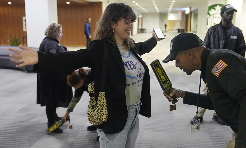 Sierra Dobbs-Brown is checked by security before entering a watch party for Issue 1 proponents, Tuesday, Nov. 7, 2023, in Columbus Ohio. (AP Photo/Sue Ogrocki)