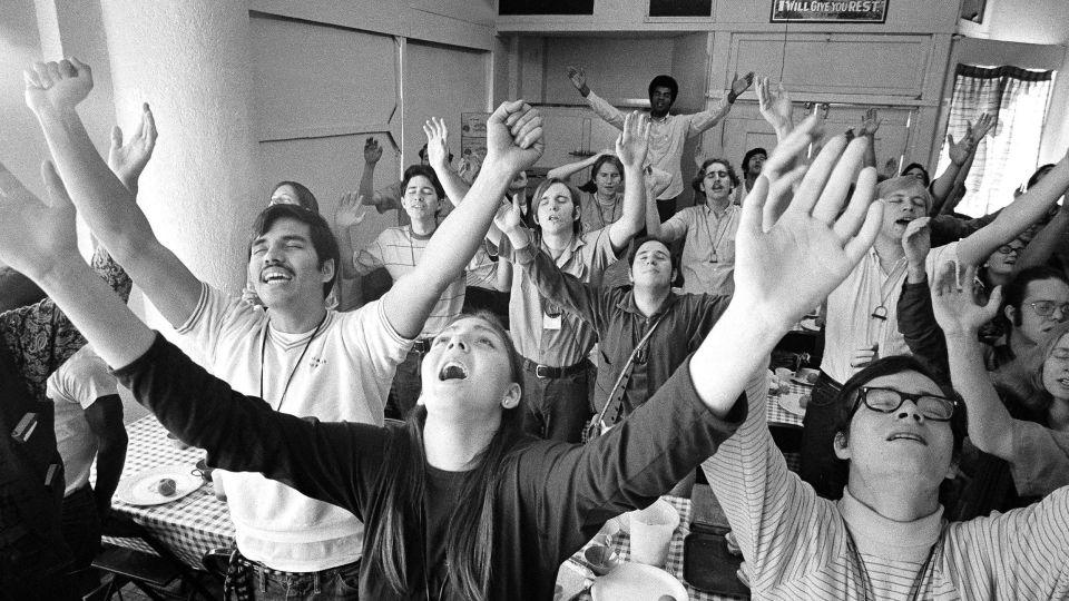 Members of what was once called the Jesus Movement sing at a Los Angeles building in 1971. Ward says his parents came out of a movement of Christians during that decade who were disenchanted with the mainstream church. - George Brich/AP