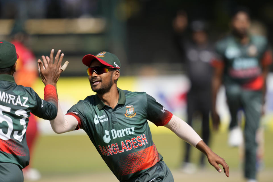 Bangladesh players celebrate a wicket on the final day of the One-Day International cricket match between Zimbabwe and Bangladesh at Harare Sports Club in Harare, Zimbabwe, Wednesday, Aug, 10, 2022. (AP Photo/Tsvangirayi Mukwazhi)