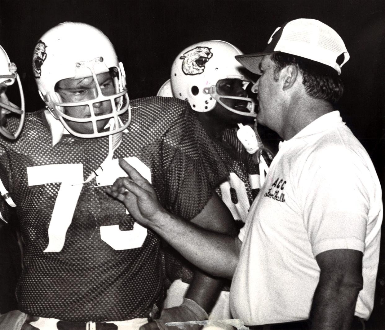 Abilene Christian's offensive tackle Don Harrison gets some sideline instruction from line coach Don Smith during ACC's 35-9 victory over Nebraska Sept. 21, 1974. Harrison went on to coach football at the college, later becoming superintendent for Wylie ISD.