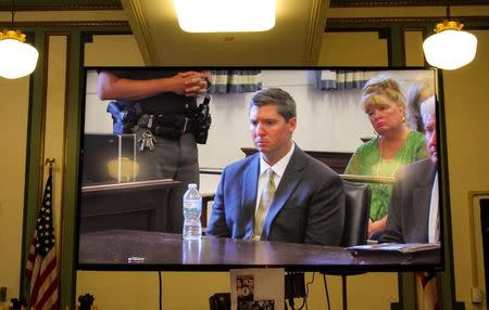 FILE PHOTO: A screen show former University of Cincinnati police officer Ray Tensing listening as the judge declares a mistrial after jury deadlocks ending the retrial in death of Samuel DuBose in Cincinnati, Ohio, U.S. June 23, 2017. REUTERS/William Philpott