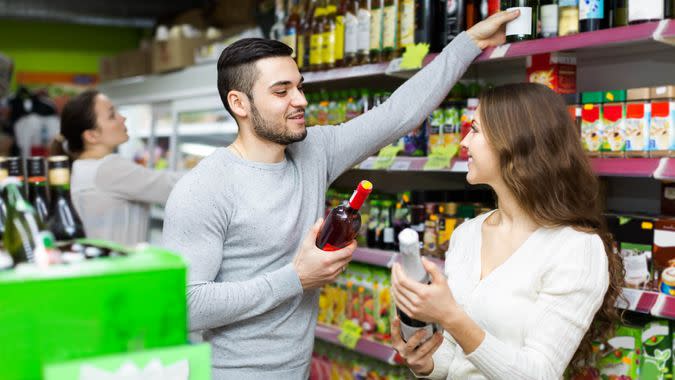 couple grocery shopping for alcohol