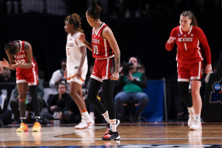 North Carolina State guard Aziaha James (10), Saniya Rivers (22) and River Baldwin react during the second half of the team’s Elite Eight college basketball game against Texas in the women’s NCAA Tournament, Sunday, March 31, 2024, in Portland, Ore. (AP Photo/Howard Lao)