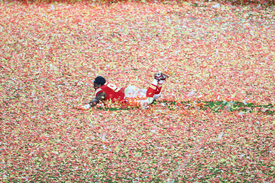 Feb 2, 2020; Miami Gardens, Florida, USA; Kansas City Chiefs nose tackle Derrick Nnadi (91) slides through the confetti after winning Super Bowl LIV at Hard Rock Stadium. Mandatory Credit: Kim Klement-USA TODAY Sports