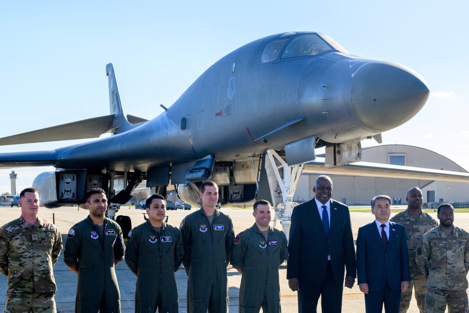 US Secretary of Defense Lloyd Austin (4R) and South Korea's Minister of National Defense Lee Jong-sup (3R) pose for a photo in front of a B-1 bomber during a visit to Andrews Air Force Base in Maryland on November 3, 2022. Mandel Ngan/Pool via REUTERS