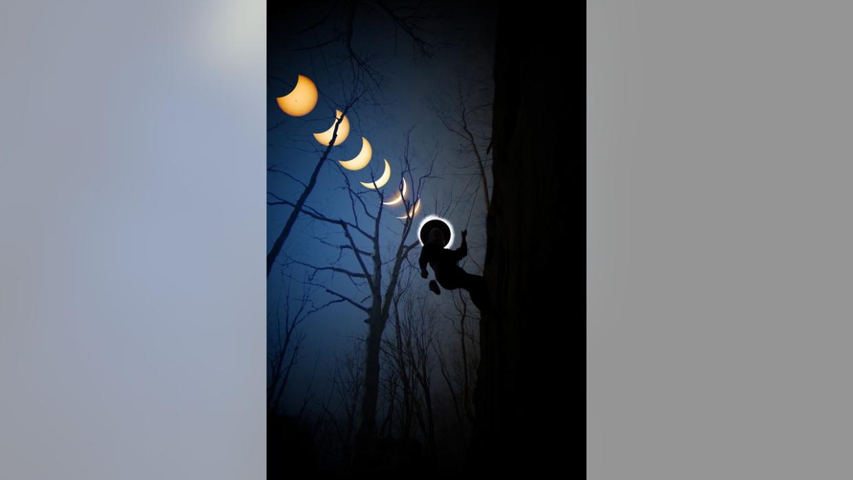<div>FOX 2 photojournalist Coulter Stuart captured the solar eclipse and the rock climber in separate images, then spliced them together. Photo Credit: Coulter Stuart</div>