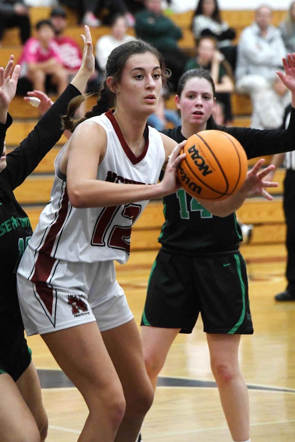 Niceville's Anna Kimball dishes off the ball during the Eagles' home game against South Walton High School on Wednesday, Nov. 30, 2022.