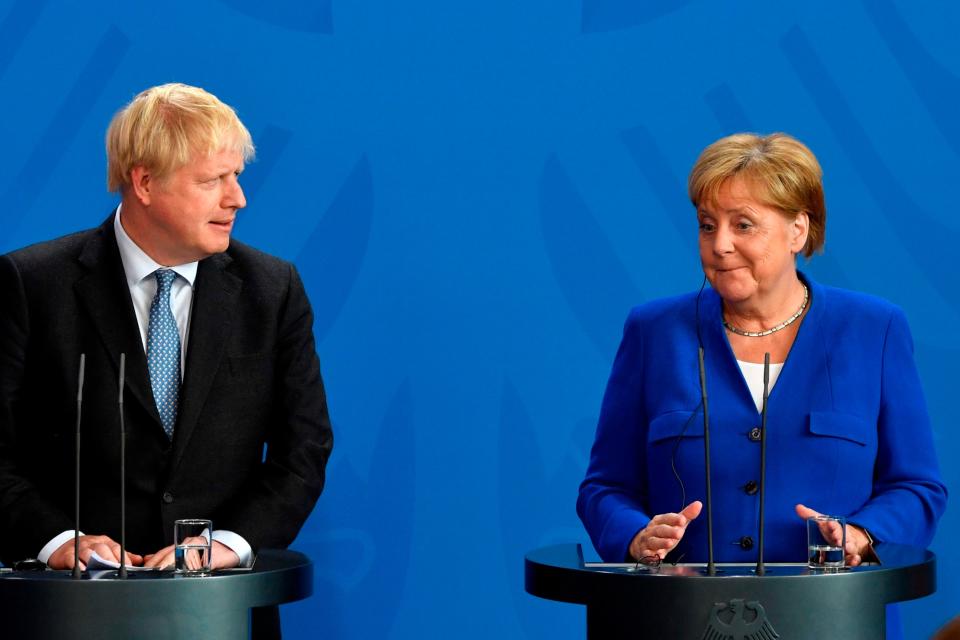 Boris Johnson and Angela Merkel (AFP/Getty Images)