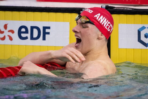 The 17-year-old athlete winced in pain before pointing to his shoulder and exiting the pool.