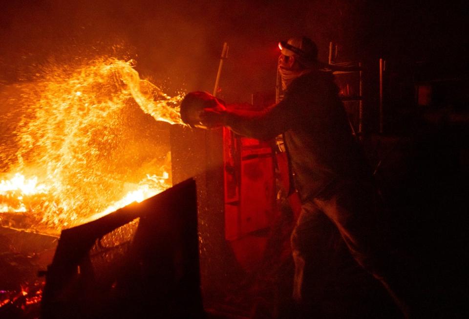 A wildfire burns in Aguanga, California in October 2023. Emissions from wildfires around the world increased by 30 per cent compared to 2022 (AP Photo/Ethan Swope)