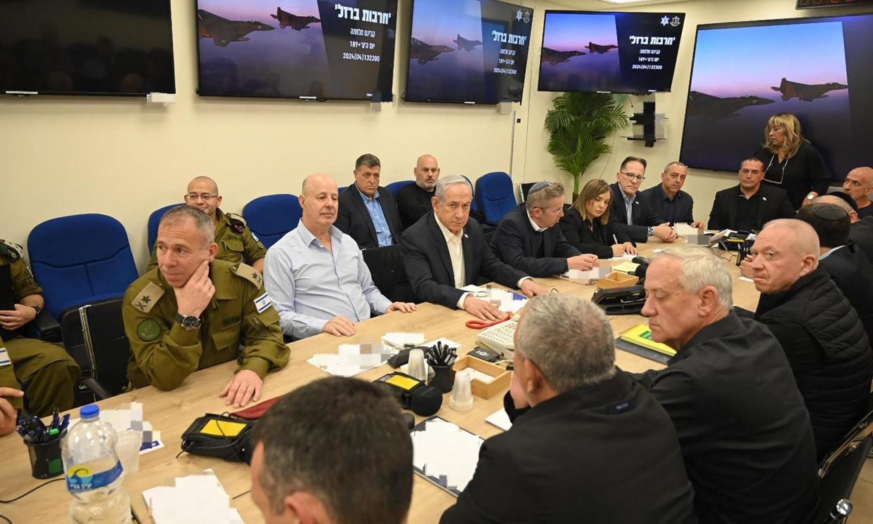 <span>Benjamin Netanyahu (centre) during an Israeli war cabinet meeting at the Kirya in Tel Aviv on Saturday to discuss Iran’s drone and missile attack.</span><span>Photograph: Israeli Prime Minister's Office/AFP/Getty Images</span>