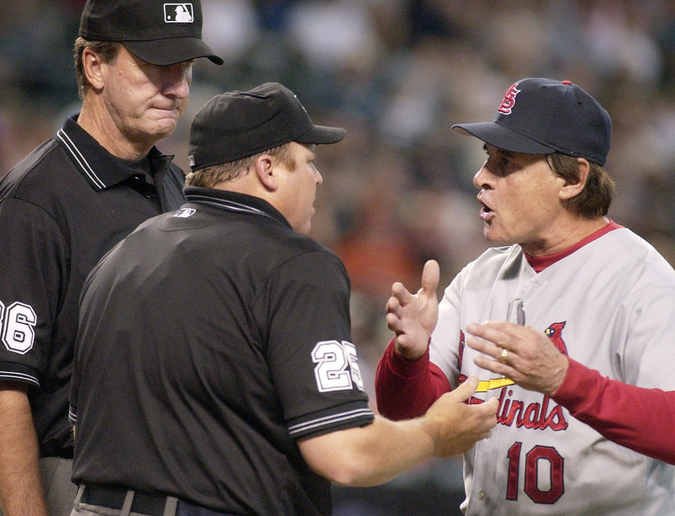 St. Louis Cardinals manager Tony La Russa, right, argues with home plate umpire Fieldin Culbreth (25) and third base umpire Tim McClelland, left, after being thrown out of the baseball game for arguing balls and strikes during the fifth inning against the Arizona Diamondbacks on Sunday, Sept. 10, 2006, in Phoenix. (AP Photo/Tom Hood)