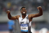 FILE - In this May 18, 2019, file photo, Noah Lyles of the United States reacts after winning the men's 100-meter race during the Diamond League Track and Field meet in Shanghai, China. The most promising signal that track and field remains in good hands even after Usain Bolt’s retirement comes from a 22-year-old American named Noah Lyles who appreciates the Jamaican superstar more for what he did after his races than during them. When Lyles spends time studying Bolt on video, he looks not at the lanky speedster’s form in between the lines, but at the dancing, rollicking post-race celebrations Bolt concocted to make his sport can’t-miss viewing whenever he was on the track. (AP Photo/File)