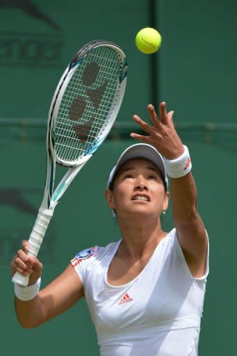 Japan's Kimiko Date-Krumm serves during her first round women's singles match against Ukraine's Kateryna Bondarenko on day three of the 2012 Wimbledon Championships tennis tournament at the All England Tennis Club in Wimbledon, southwest London