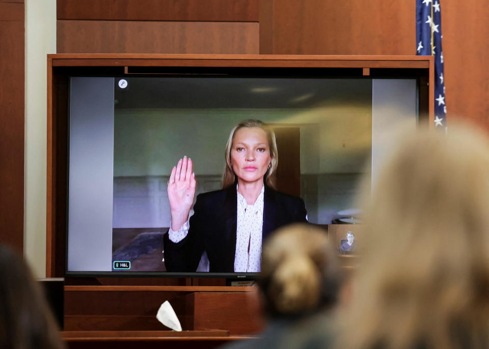 Model Kate Moss, a former girlfriend of actor Johnny Depp,  is sworn in to testify via video link during Depp's defamation trial against his ex-wife Amber Heard, at the Fairfax County Circuit Courthouse in Fairfax, Virginia, May 25, 2022. / Credit: EVELYN HOCKSTEIN/REUTERS
