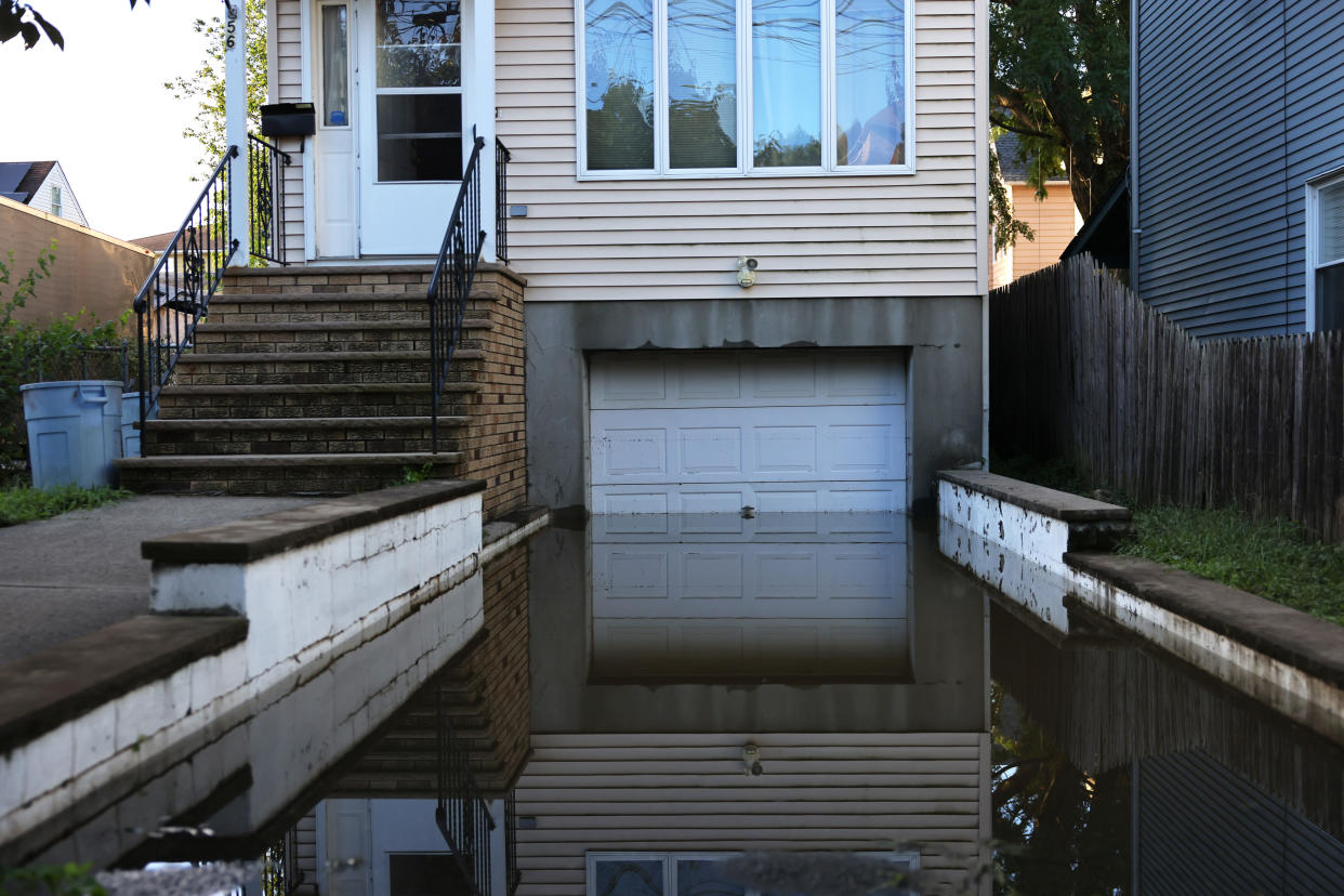 Floodwaters lead into a garage in Passaic City, N.J., on Thursday.