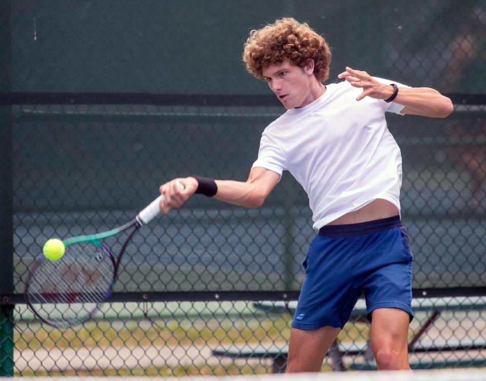 Winter Haven sophomore Ben Saltman hits a forehand return during the FHSAA Class 4A Boys Tennis Championships at Sanlando Park in Altamonte Springs.
