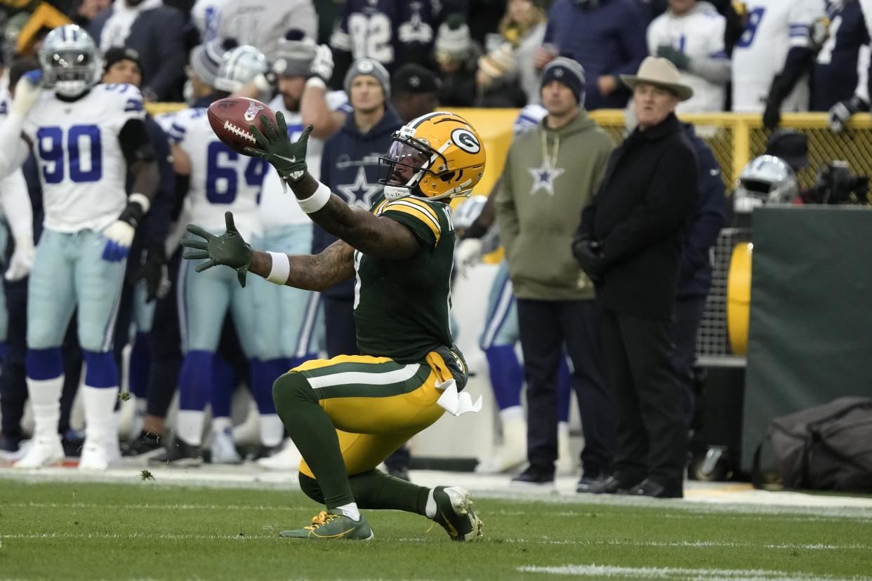 Green Bay Packers wide receiver Amari Rodgers bobbles a punt, but recovers and returns the ball for a short gain during the first half of an NFL football game against the Dallas Cowboys, Sunday, Nov. 13, 2022, in Green Bay, Wis. (AP Photo/Morry Gash)