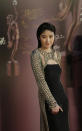 Hong Kong actress Kelly Chen poses on the red carpet of the 33rd Hong Kong Film Awards in Hong Kong Sunday, April 13, 2014. (AP Photo/Vincent Yu)