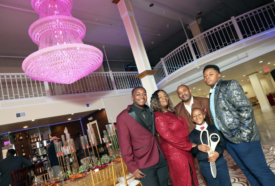 Ann's Palace owners Rose Calixte, and Jacquecy, sons Carlyle, left, Jaylen, right, and Kyle Calixte, at 275 Main Street in Brockton on Friday, June 9, 2023.  