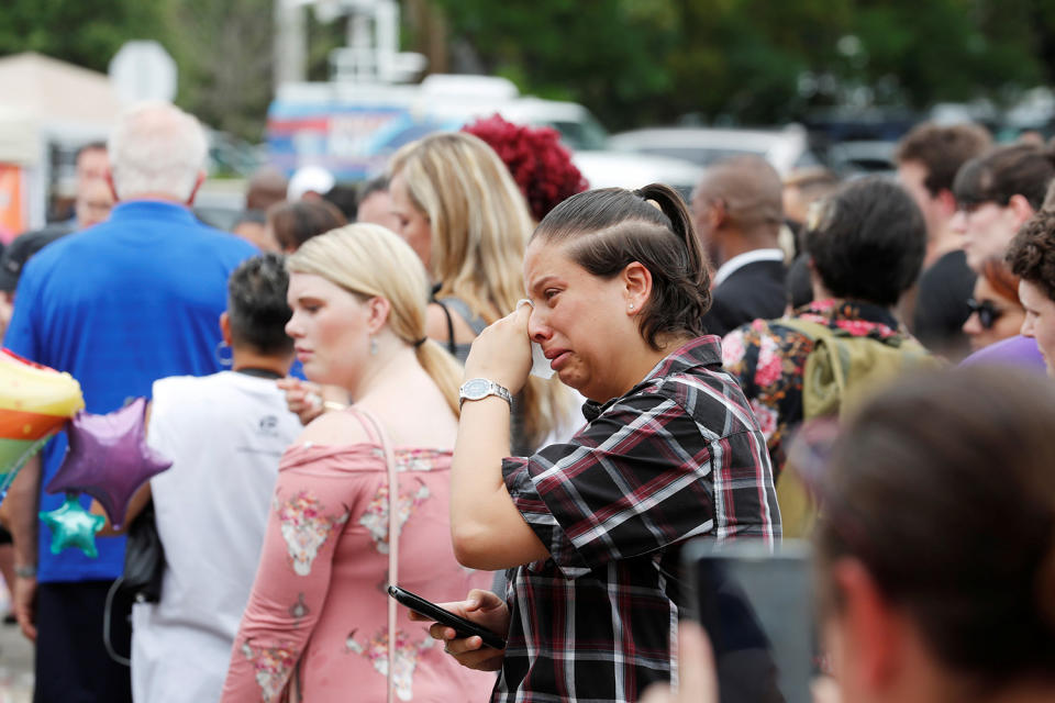 <p>Guests react to the memorial outside the Pulse Nightclub on the one-year anniversary of the shooting in Orlando, Florida, June 12, 2017. (Scott Audette/Reuters) </p>