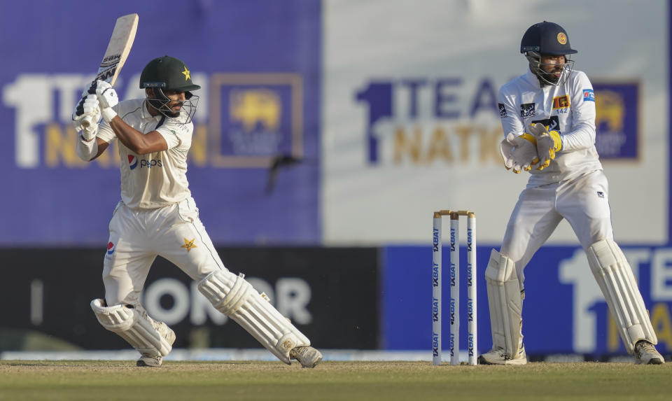 Pakistan's Saud Shakeel plays a shot as Sri Lankan wicketkeeper Sadeera Samarawickrama watches during the third day of the first cricket test match between Sri Lanka and Pakistan in Galle, Sri Lanka, on Tuesday, July 18, 2023. (AP Photo/Eranga Jayawardena)