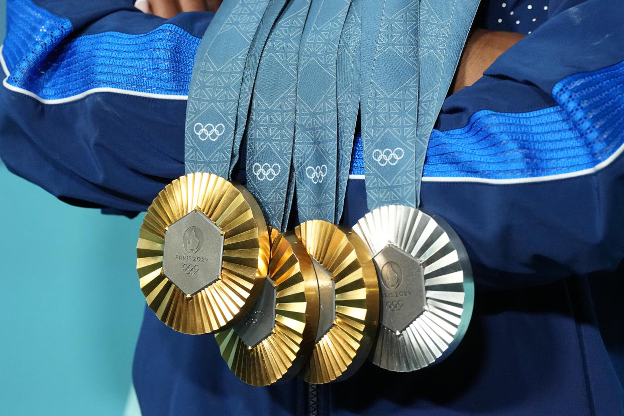 Gymnastics: 2024 Summer Olympics:  A close up of Team USA Simone Biles posing victorious with her three gold and one silver medal following the Women's floor exercise final at Bercy Arena.
Paris, France 8/5/2024 
CREDIT: Erick W. Rasco (Photo by Erick W. Rasco/Sports Illustrated via Getty Images) 
(Set Number: X164573 TK1)