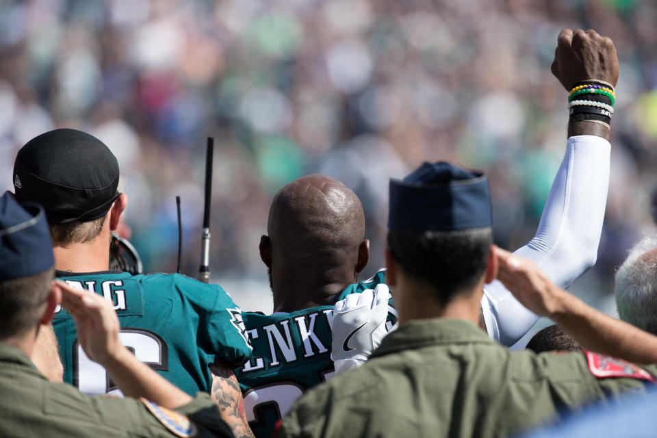 Philadelphia Eagles strong safety Malcolm Jenkins (27) and defensive end Chris Long (56) stand for the anthem prior to a game against the New York Giants on Sunday. (Photo: Bill Streicher/USA Today Sports via Reuters)