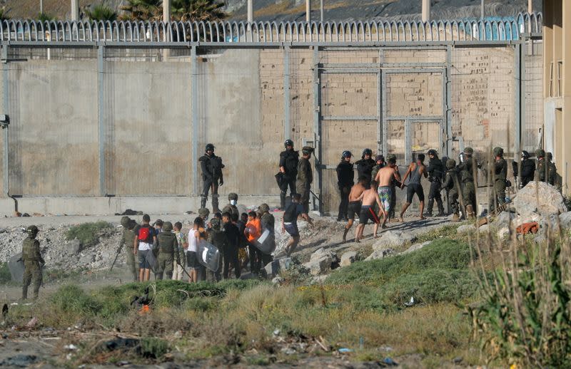 Thousands of migrants cross the Spanish-Moroccan border