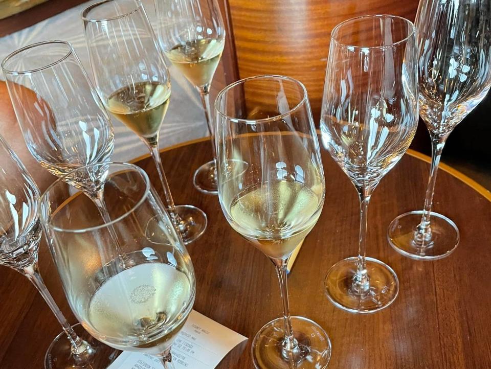 champagne glasses lined up for a tasting on a disney cruise