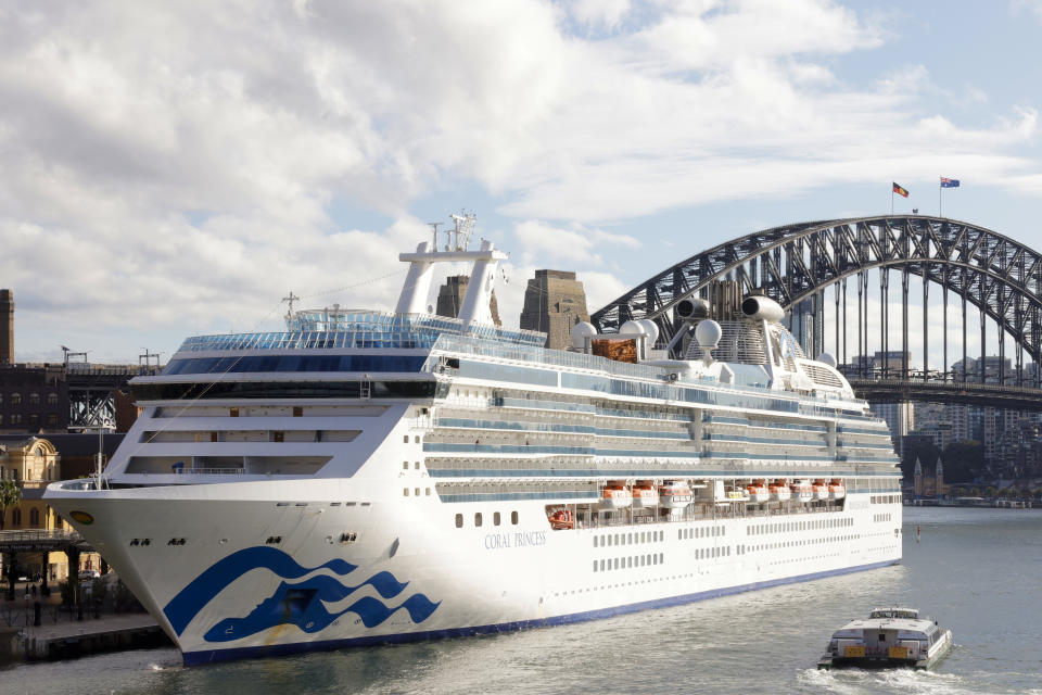 SYDNEY, AUSTRALIA - JULY 13: The Coral Princess docks at Circular Quay on July 13, 2022 in Sydney, Australia. The Coral Princess, currently experiencing a COVID-19 outbreak on board, arrived in Sydney on Wednesday morning. (Photo by Jenny Evans/Getty Images)
