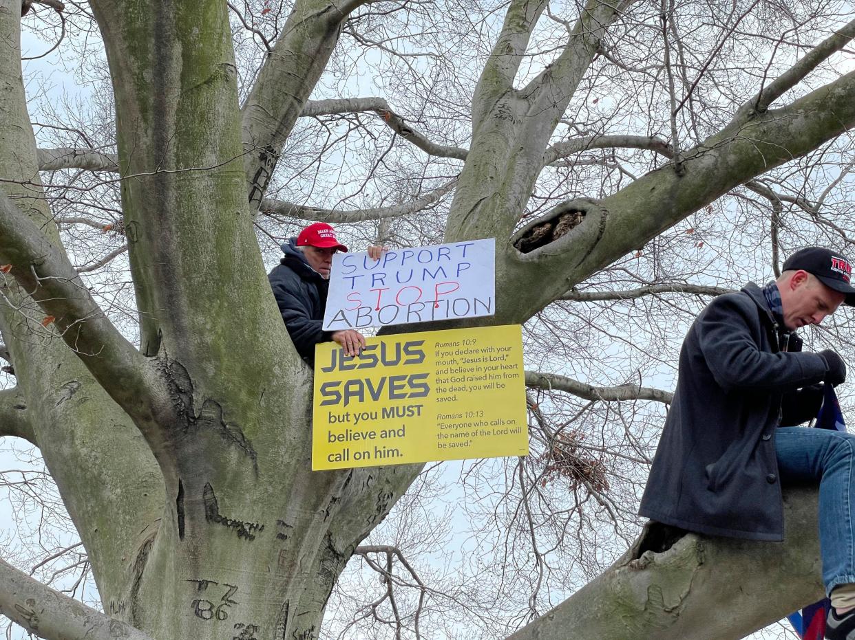 A Trump supporter displays a "Jesus Saves" sign at a rally at the U.S. Capitol on Jan. 6. (Photo: zz/STRF/STAR MAX/IPx)