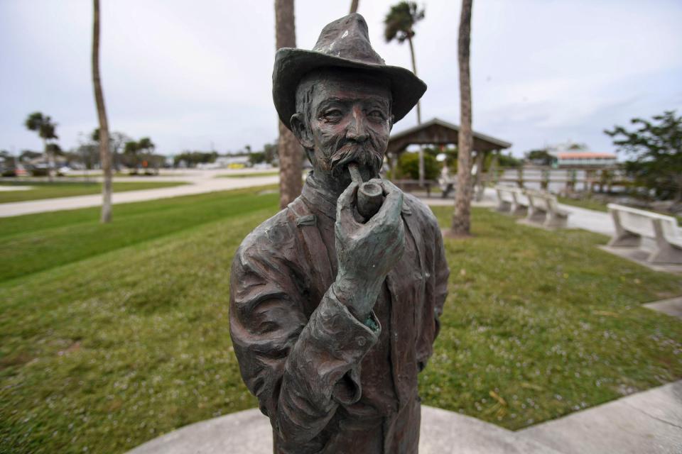 A bronze statue of Paul Kroegel, who became the first wildlife refuge manager in the United States, is seen on Dec. 14, 2023, overlooking the Indian River Lagoon in Sebastian on Riverside Drive. The statue, erected in 2002, faces Pelican Island National Wildlife Refuge's 3-acre island in the lagoon, so that Kroegel permanently watches over his beloved birds.