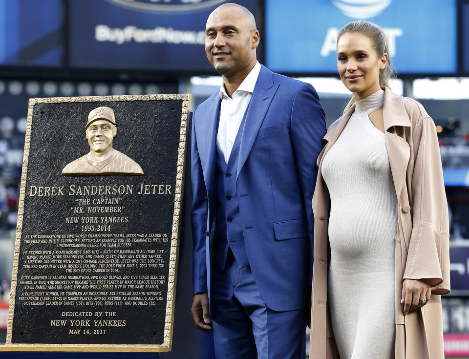 Derek Jeter and his wife Hannah at his number retirement ceremony in May. (AP)