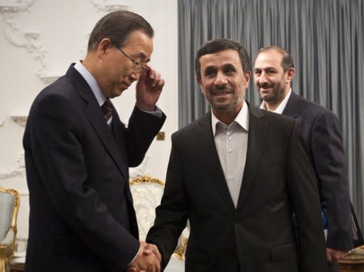 Iranian President Mahmoud Ahmadinejad (R) and UN Secretary General Ban Ki-Moon (L) shake hands in Tehran on August 29. A showpiece summit hosted by Iran stumbled as soon as it opened on Thursday when the head of the UN pressed Tehran on its nuclear stand, and Egypt's new leader publicly sided with Syria's opposition