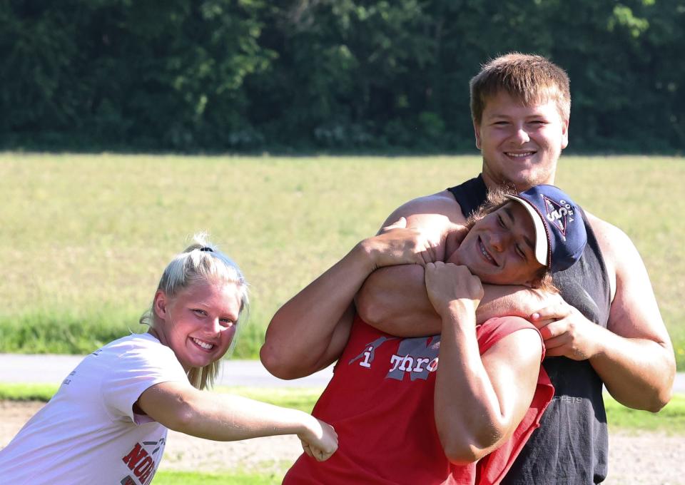 Norwayne's Allie Morlock, Colby Morlock and Dillon Morlock enjoy a light-hearted moment on the family farm as they prepare for state this weekend.