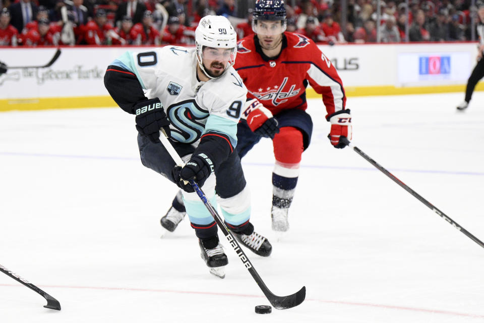 FILE - Seattle Kraken left wing Marcus Johansson (90) in action during the second period of an NHL hockey game against the Washington Capitals, Saturday, March 5, 2022, in Washington. Marcus Johansson is heading back to the team that drafted him. The Washington Capitals acquired Johansson from the expansion Seattle Kraken, according to a second person with knowledge of the situation who also spoke on condition of anonymity because the deal had not been announced. (AP Photo/Nick Wass, File)