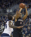 San Diego State forward Matt Mitchell (11) shoots over Nevada forward Jordan Caroline (24) in the first half of an NCAA college basketball game in Reno, Nev., Saturday, March 9, 2019. (AP Photo/Tom R. Smedes)