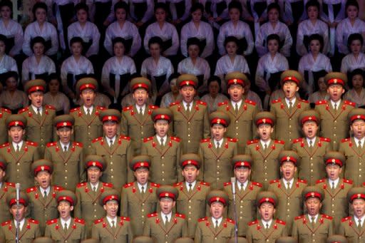 North Korean performers sing at a theatre during celebrations to mark the 100th birth anniversary of the country's founding leader Kim Il-Sung in Pyongyang on April 16. North Korea demanded Thursday that South Korea apologise for what it called insults during major anniversary festivities, or face a "sacred war", as Seoul unveiled a new missile to deter its neighbour