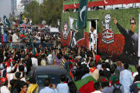 Supporters of Pakistan’s defiant former Prime Minister Imran Khan take part in an anti-government rally in Islamabad, Pakistan, Thursday, May 26, 2022. Khan early Thursday warned Pakistan's government to set new elections in the next six days or he will again march on the capital along with 3 million people. (AP Photo/Anjum Naveed)