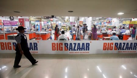 A security personnel walks past the Big Bazaar retail store in Mumbai
