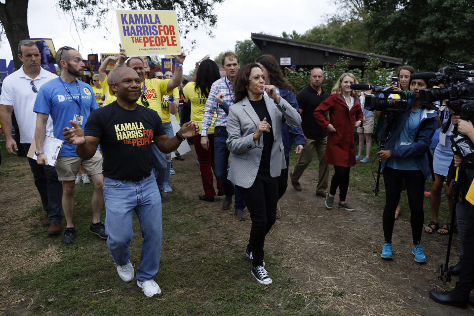 Democratic presidential candidate Kamala Harris, D-Calif., marches with supporters during the Polk County Democrats Steak Fry, Saturday, Sept. 21, 2019, in Des Moines, Iowa. (AP Photo/Charlie Neibergall)