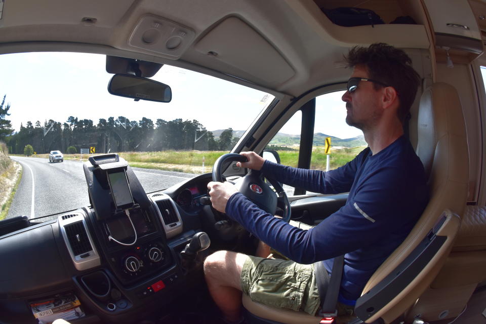 This Dec. 22, 2019, photo taken with a fisheye lens shows Malcolm Foster driving a rented camper van on the South Island of New Zealand. Touring in a camper van is a popular way for tourists to see the country. (Jacob Foster via AP)