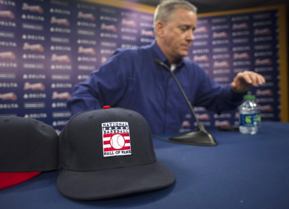 Former Atlanta Braves pitcher Tom Glavine gets up from a news conference at Turner Field on Wednesday, Jan. 8, 2014, in Atlanta. Glavine, former Braves teammate Greg Maddux and Frank Thomas were elected to baseball's Hall of Fame on Wednesday. (AP Photo/John Amis)