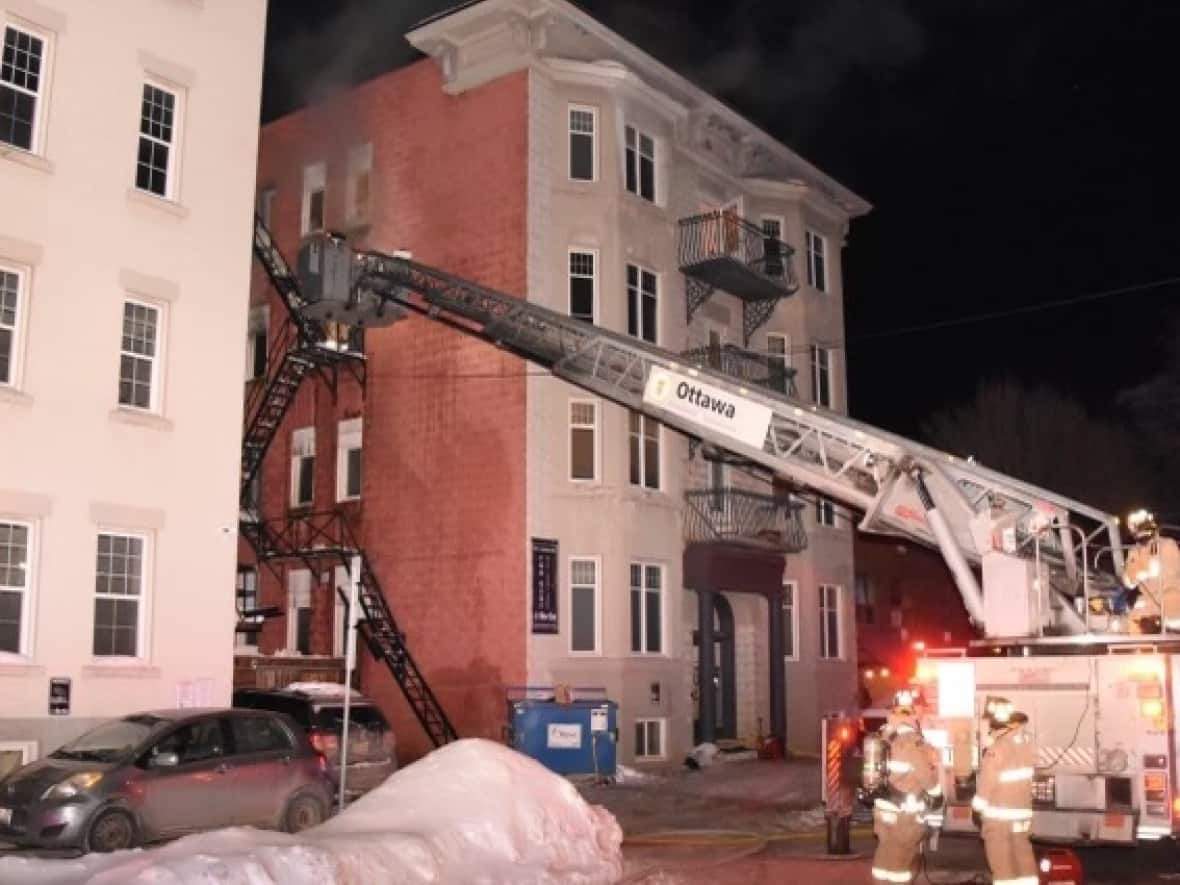 In the first of a trio of overnight fires, residents had to flee this Daly Avenue apartment complex around 2 a.m. The fires all occurred on one of the coldest nights of the winter. (Jean Lalonde/Ottawa Fire Services - image credit)
